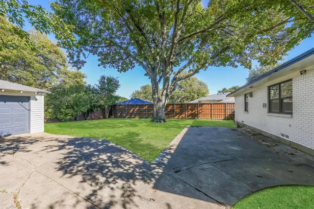 a front view of a house with yard