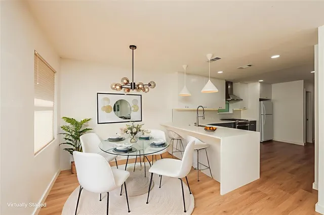a dining room with furniture and window