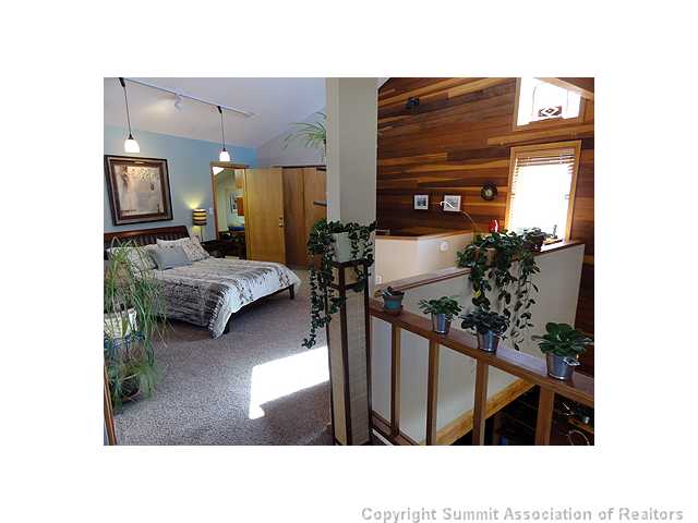 9460 Ryan Gulch Road, Unit 485 Silverthorne, CO 80498 - Photo 13 of 23 Master Bedroom.