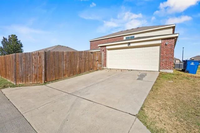 a view of a backyard of a house