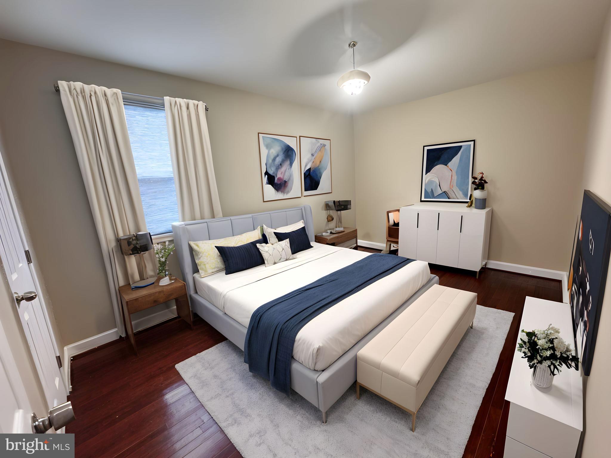 2326 25th Street Southeast Washington, DC 20020 - Photo 9 of 10 a bed room with a bed and a window