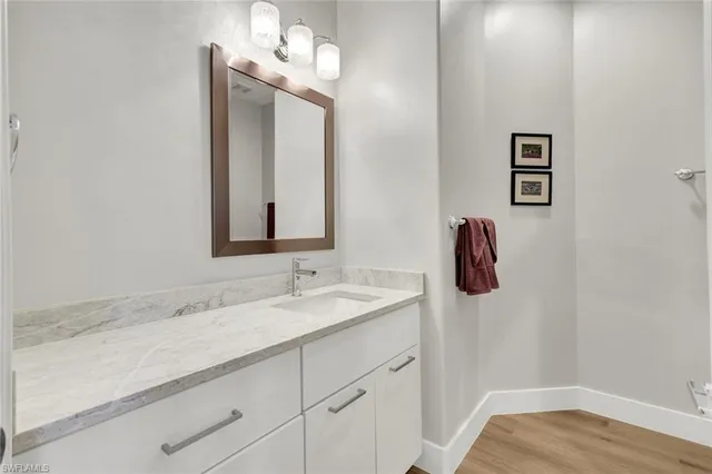 a bathroom with a sink and a mirror