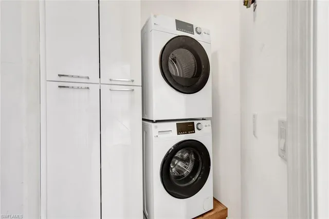 a view of a hallway with washer and dryer