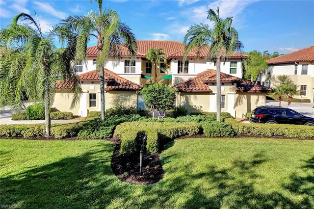 a front view of house and yard with green space