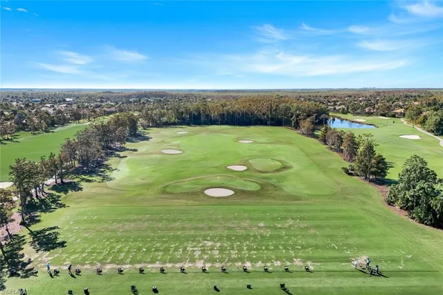 a view of a swimming pool and an outdoor seating