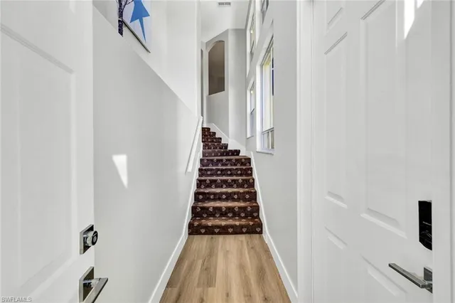 a view of a hallway view with staircase