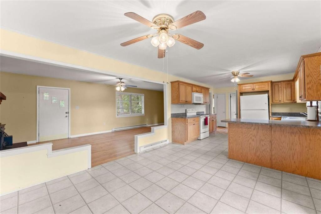 3772 Ledan Road Gainesville, GA 30506 - Photo 15 of 33 a open kitchen with cabinets and a stove top oven