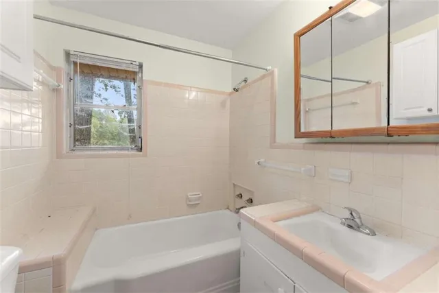 a bathroom with a sink and a bathtub