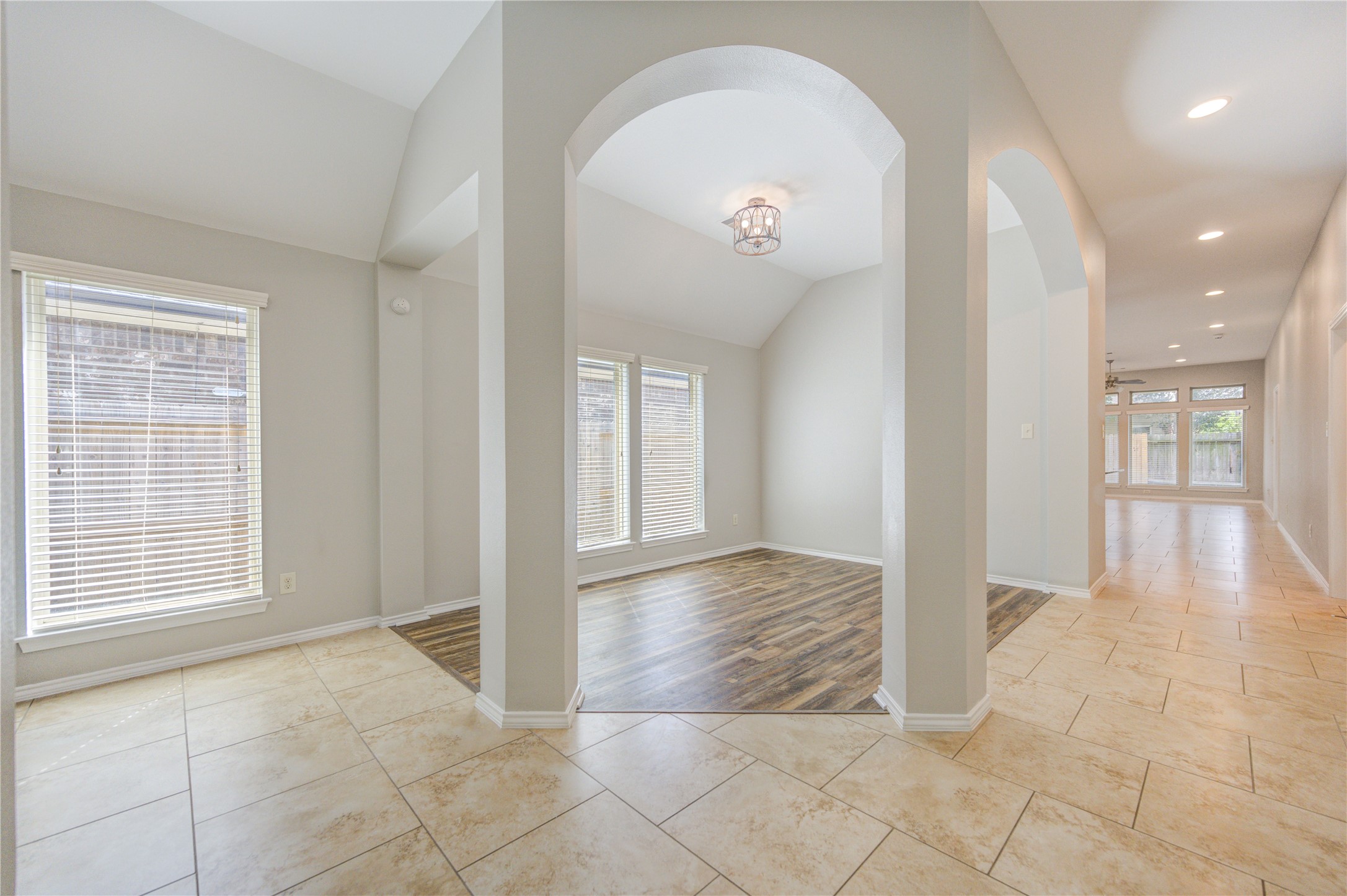 27407 Gatlin Lane Spring, TX 77386 - Photo 10 of 35 From the moment you step inside, the home's thoughtful design is on full display. Elegant archways, soaring ceilings, and a light-filled foyer create a welcoming first impression, while the open sightlines lead effortlessly to the flexible dining space and expansive living areas beyond. The flowing layout offers both everyday comfort and an ideal setting for entertaining.