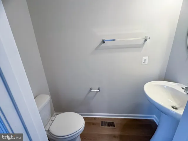 a bathroom with a toilet and a sink
