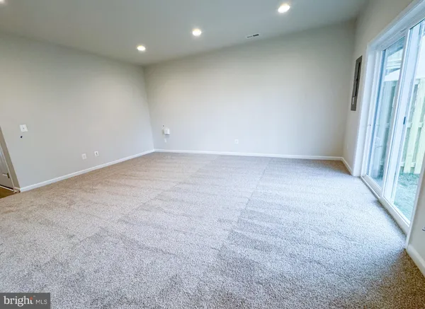 an empty room with a fireplace