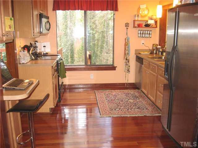 3116 Hope Valley Road Durham, NC 27707 - Photo 4 of 24 Owners re-did the kitchen with wood floors, upgraded counters and stainless steel appliances that all convey! Kitchen