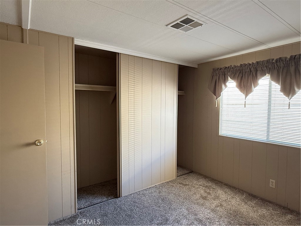 2240 Golden Oak Lane, Unit 108 Merced, CA 95341 - Photo 13 of 30 a view of an empty room with a window