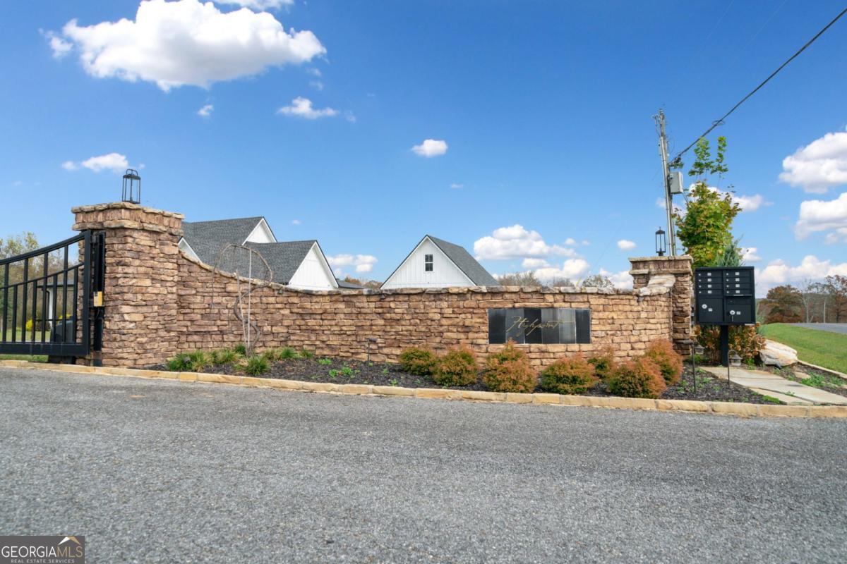 Lot 7 Highpoint Ridge Road, Unit 7 Ellijay, GA 30536 - Photo 3 of 29 a view of a house with a yard and potted plants