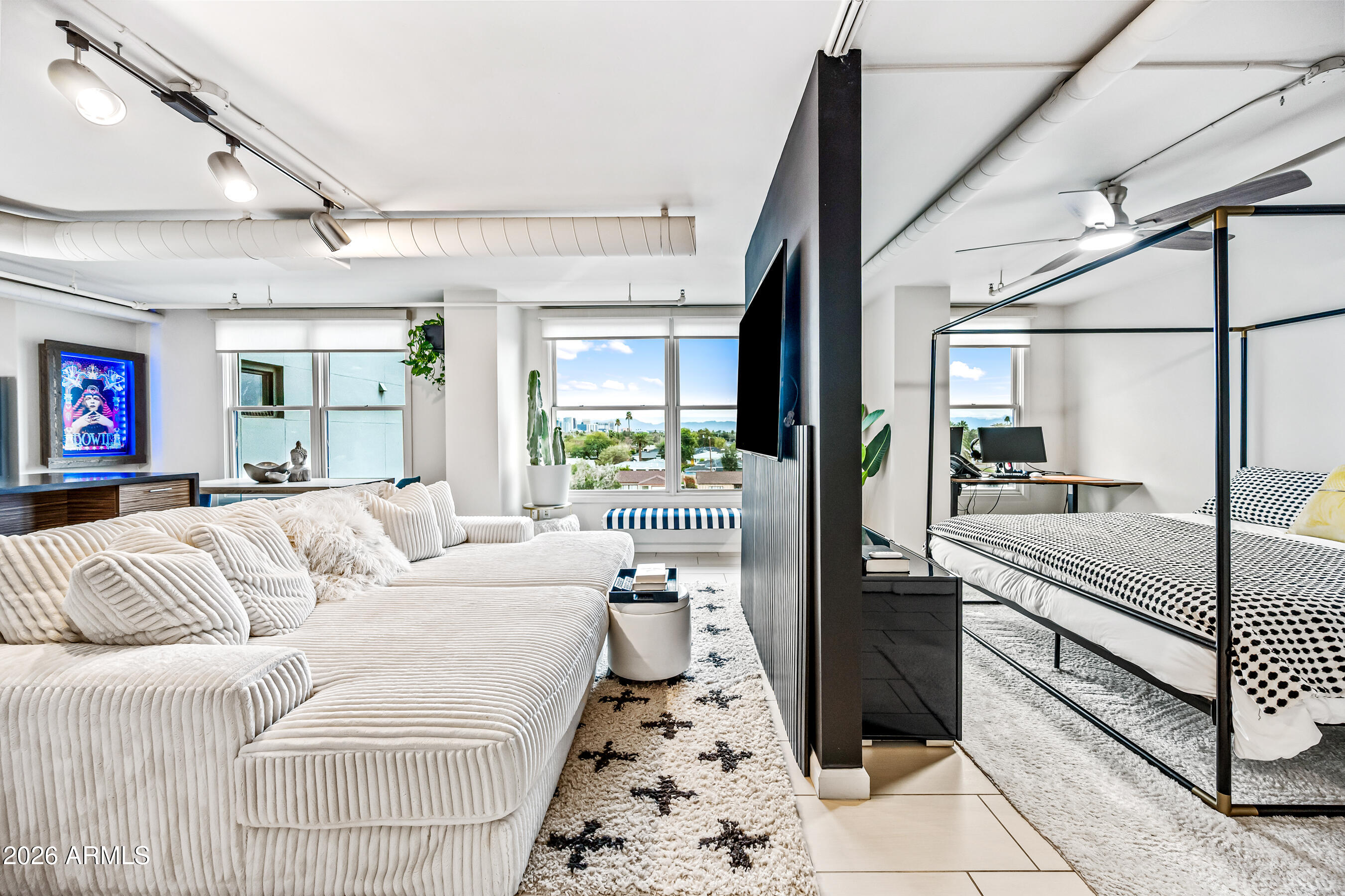 535 West Thomas Road, Unit 407 Phoenix, AZ 85013 - Photo 12 of 42 a living room with furniture and a large window