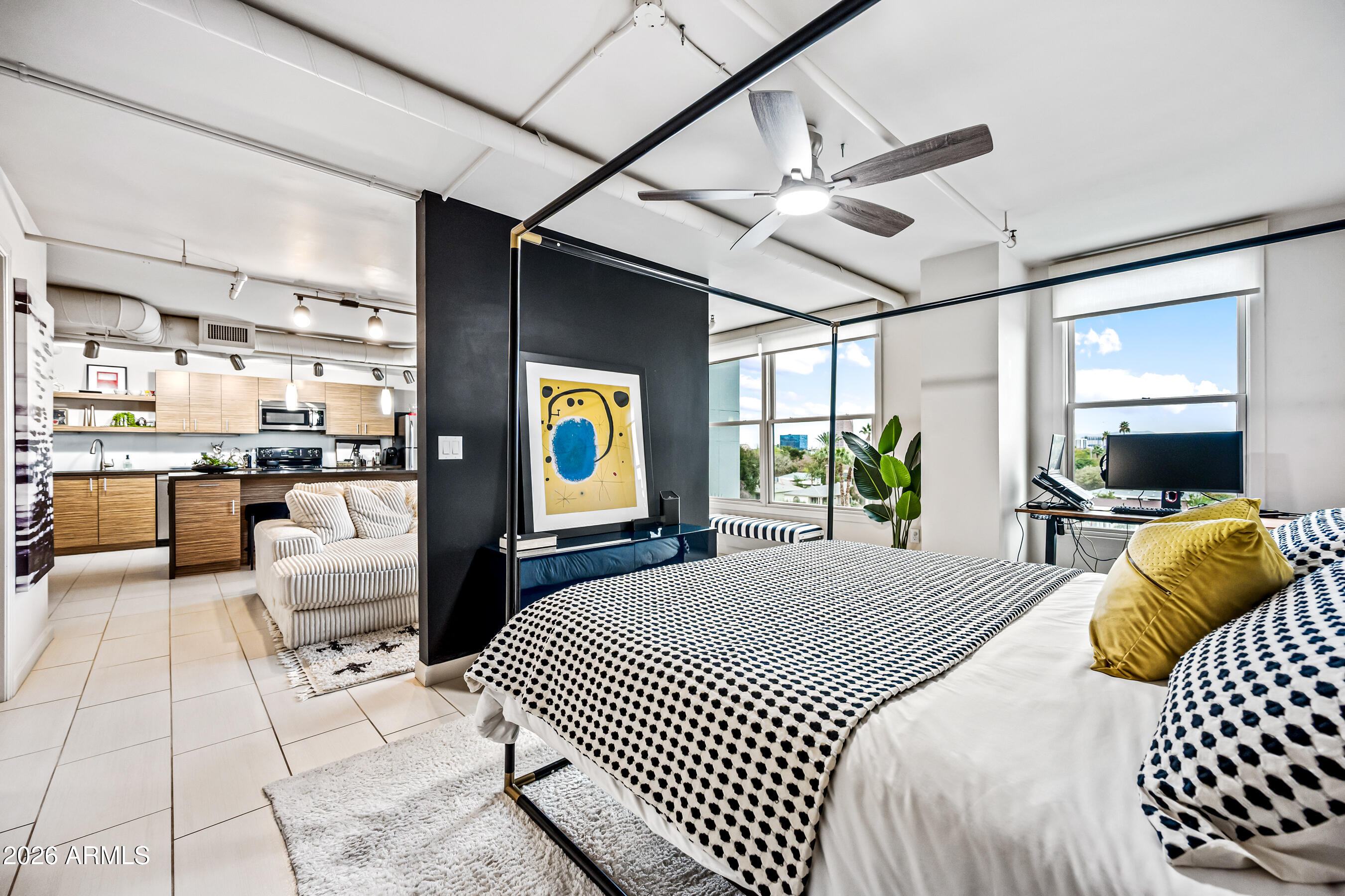 535 West Thomas Road, Unit 407 Phoenix, AZ 85013 - Photo 17 of 42 a bedroom with a bed and a large window