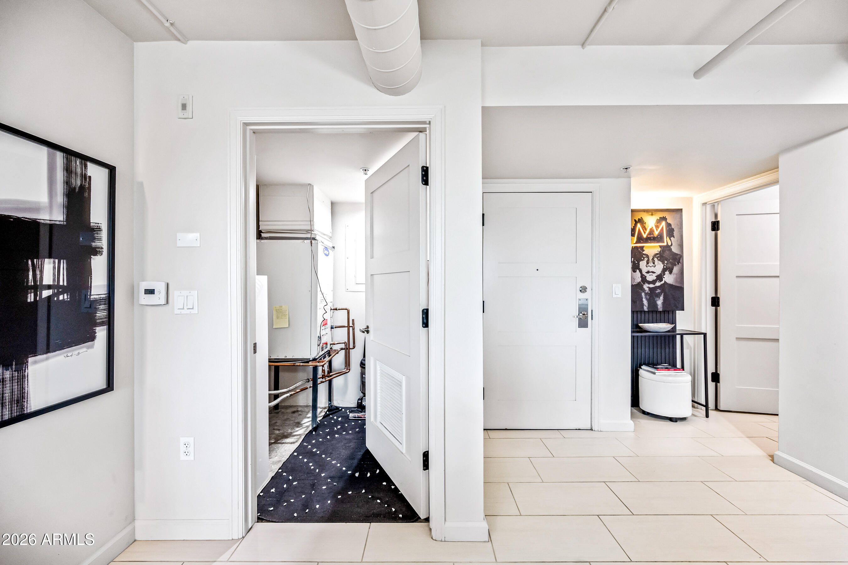 535 West Thomas Road, Unit 407 Phoenix, AZ 85013 - Photo 22 of 42 a view of a hallway with wooden floor and cabinet