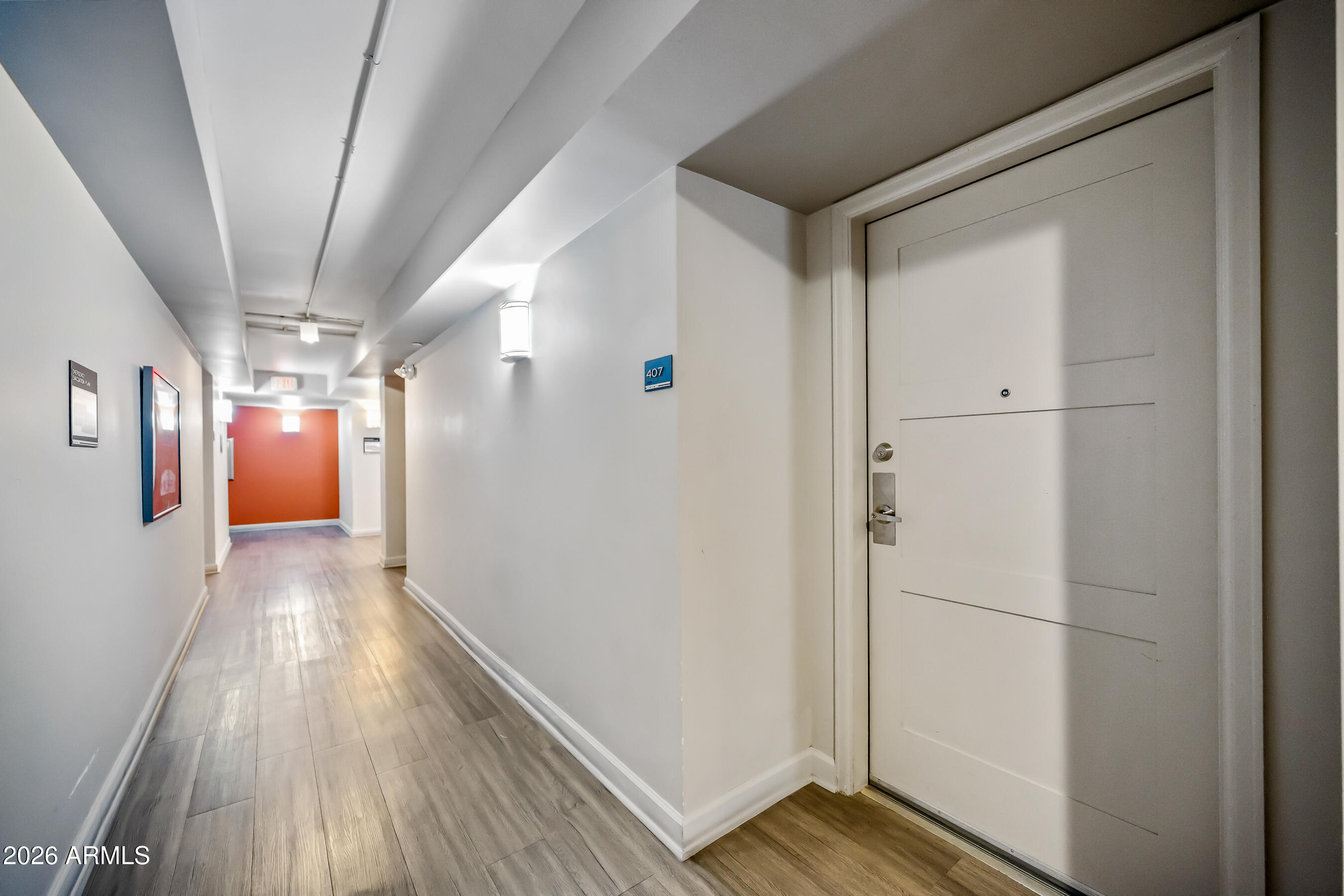 535 West Thomas Road, Unit 407 Phoenix, AZ 85013 - Photo 30 of 42 a view of hallway with wooden floor