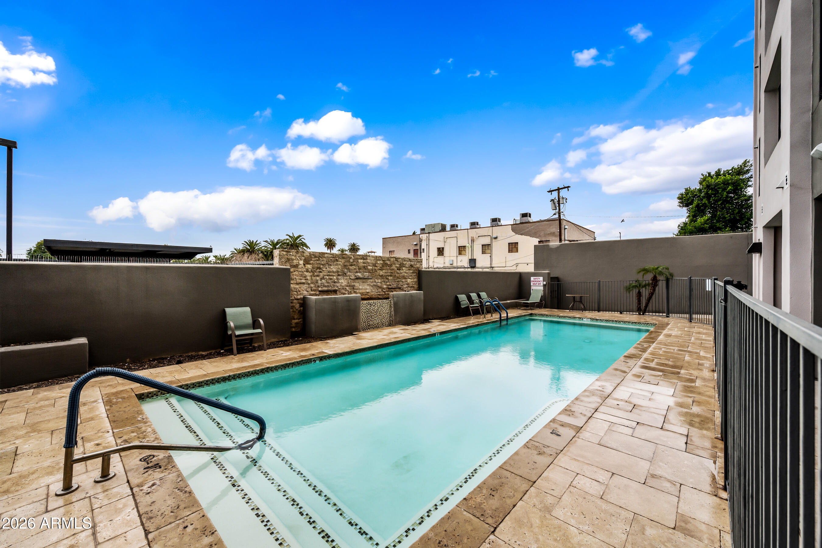 535 West Thomas Road, Unit 407 Phoenix, AZ 85013 - Photo 32 of 42 a view of a terrace with lawn chairs