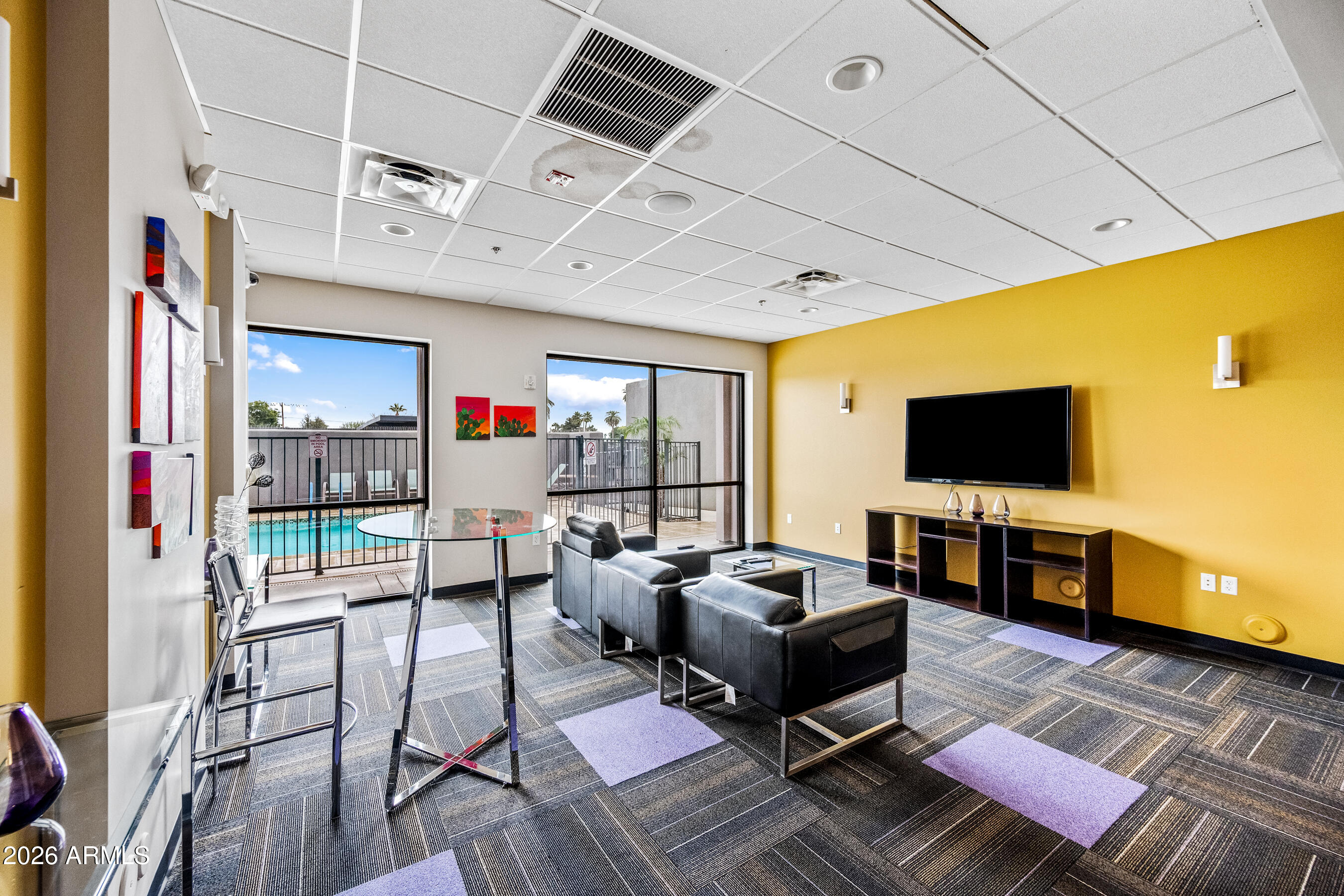 535 West Thomas Road, Unit 407 Phoenix, AZ 85013 - Photo 34 of 42 a living room with furniture and a flat screen tv
