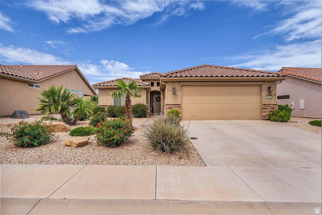 4574 South Elrose Drive St. George, UT 84790 - Photo 1 of 1 Mediterranean / spanish-style house with a garage, stucco siding, driveway, and a tile roof