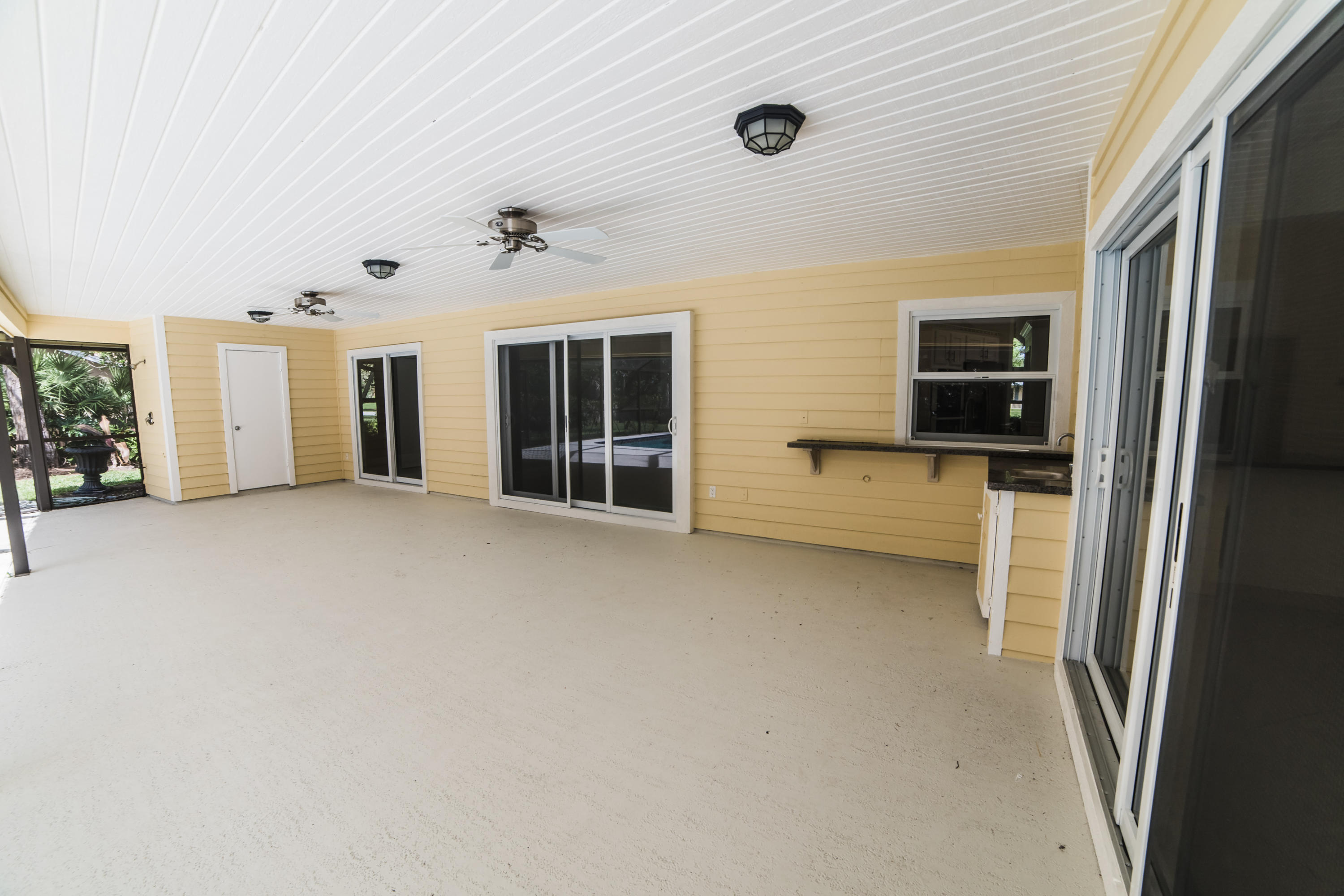 6230 Wood Lake Road Jupiter, FL 33458 - Photo 34 of 44 Covered Outdoor living area.jpg