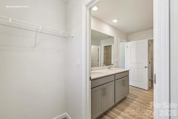 a bathroom with a granite countertop sink mirror and double