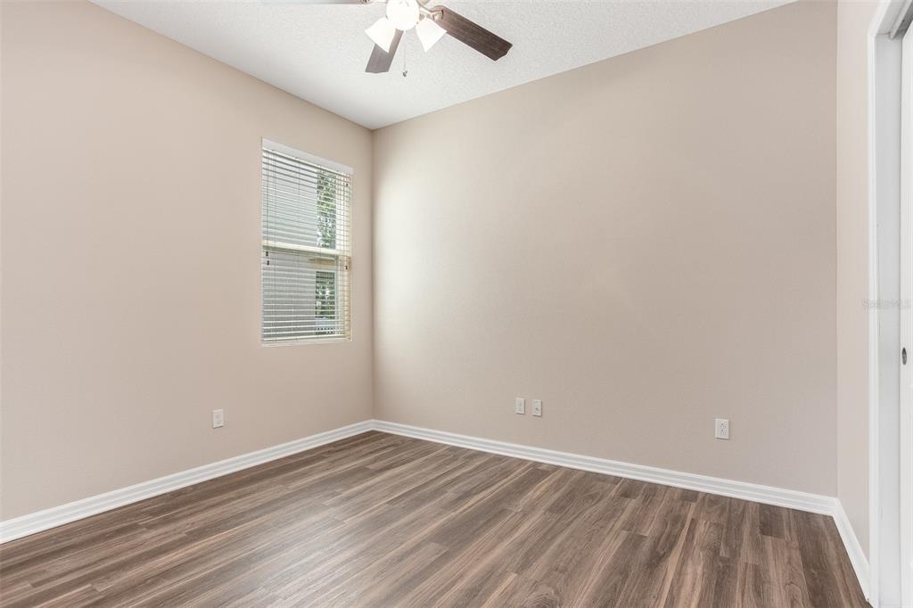 2520 Plumadore Drive Grand Island, FL 32735 - Photo 13 of 19 an empty room with a window and a ceiling fan