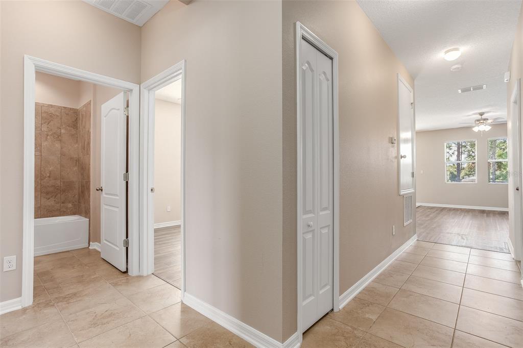 2520 Plumadore Drive Grand Island, FL 32735 - Photo 5 of 19 a view of entryway with white walls and windows