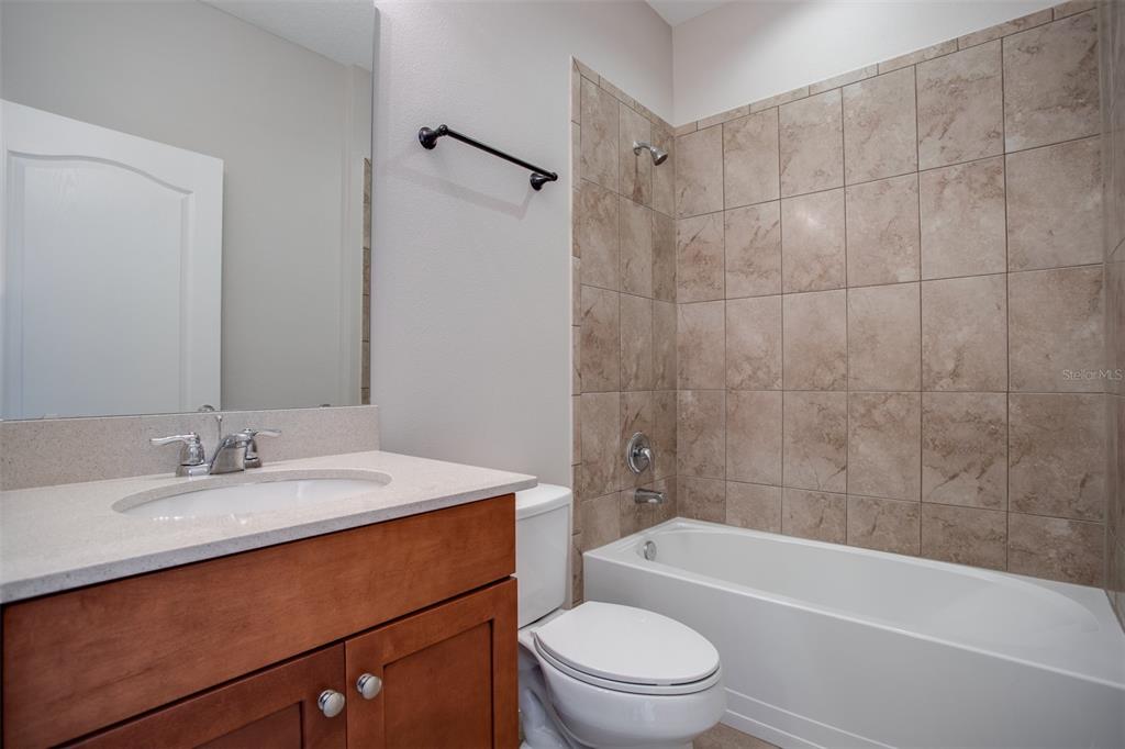 2520 Plumadore Drive Grand Island, FL 32735 - Photo 6 of 19 a bathroom with a sink a toilet and bathtub
