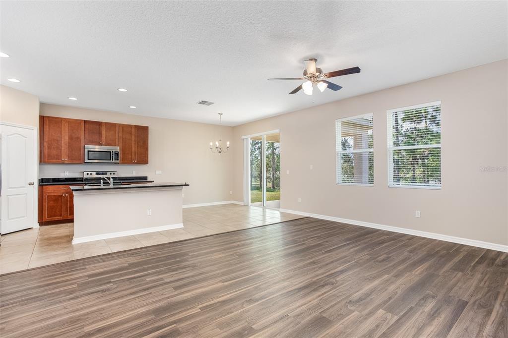 2520 Plumadore Drive Grand Island, FL 32735 - Photo 9 of 19 a view of kitchen with refrigerator microwave and stove