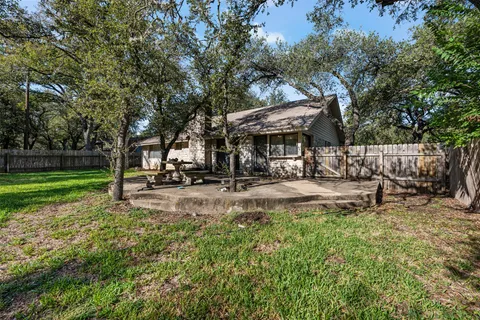 a front view of house with yard and seating area