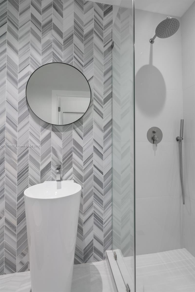 1320 Cleveland Road Miami Beach, FL 33141 - Photo 14 of 16 a bathroom with a sink toilet and shower