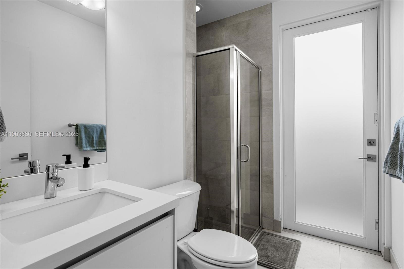 10330 Northwest 68th Street Doral, FL 33178 - Photo 20 of 60 a bathroom with a sink toilet and shower