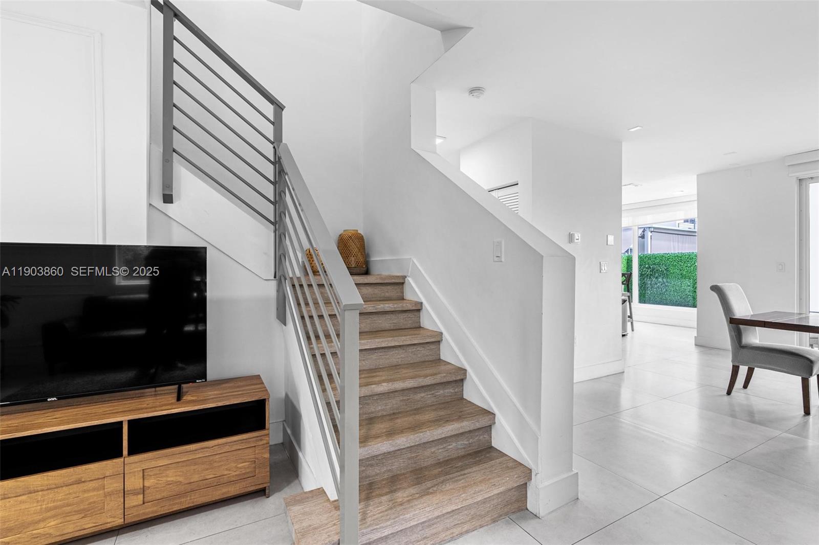 10330 Northwest 68th Street Doral, FL 33178 - Photo 23 of 60 a view of entryway and hall with wooden floor