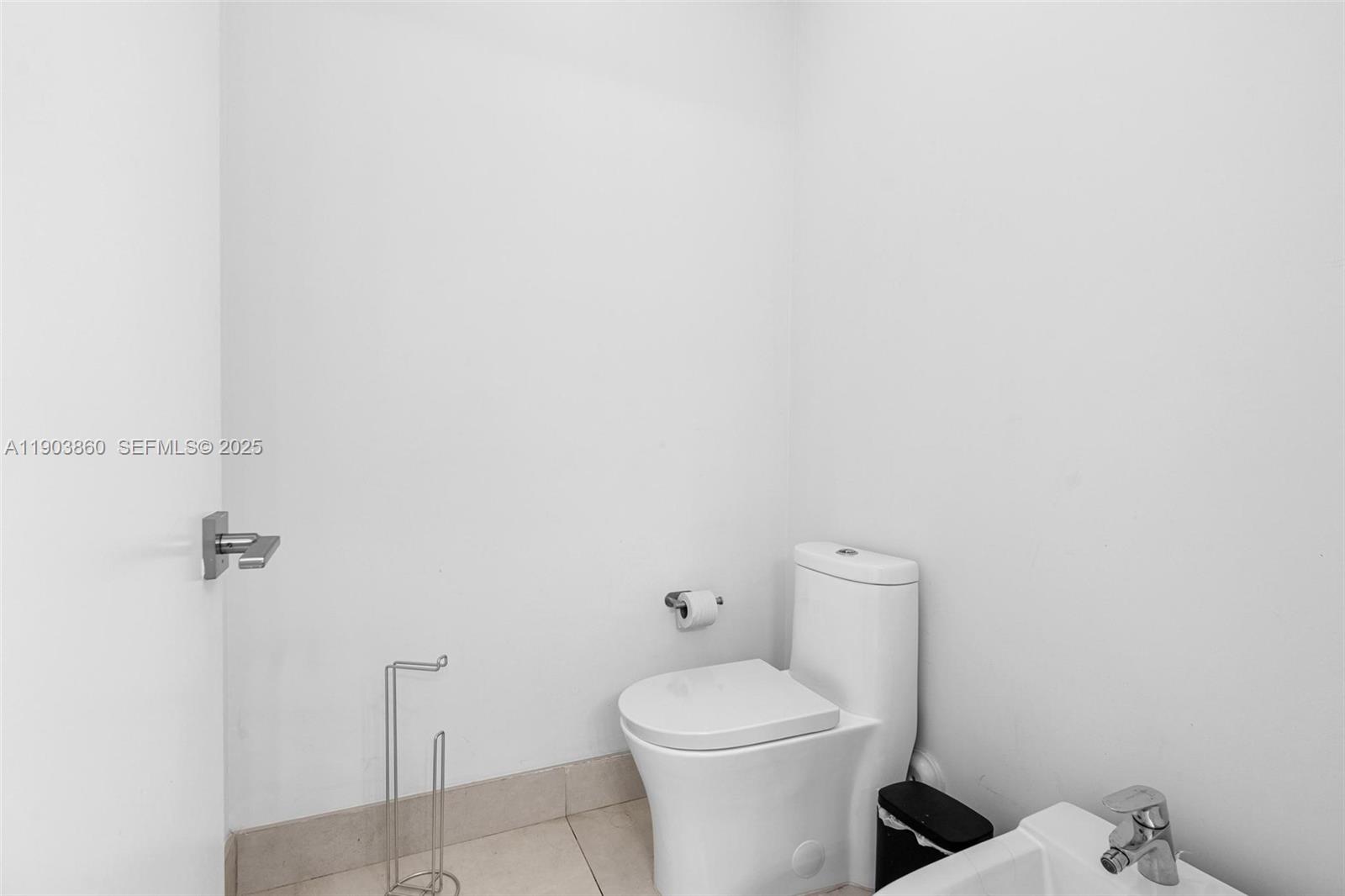 10330 Northwest 68th Street Doral, FL 33178 - Photo 31 of 60 a white toilet sitting next to a shower