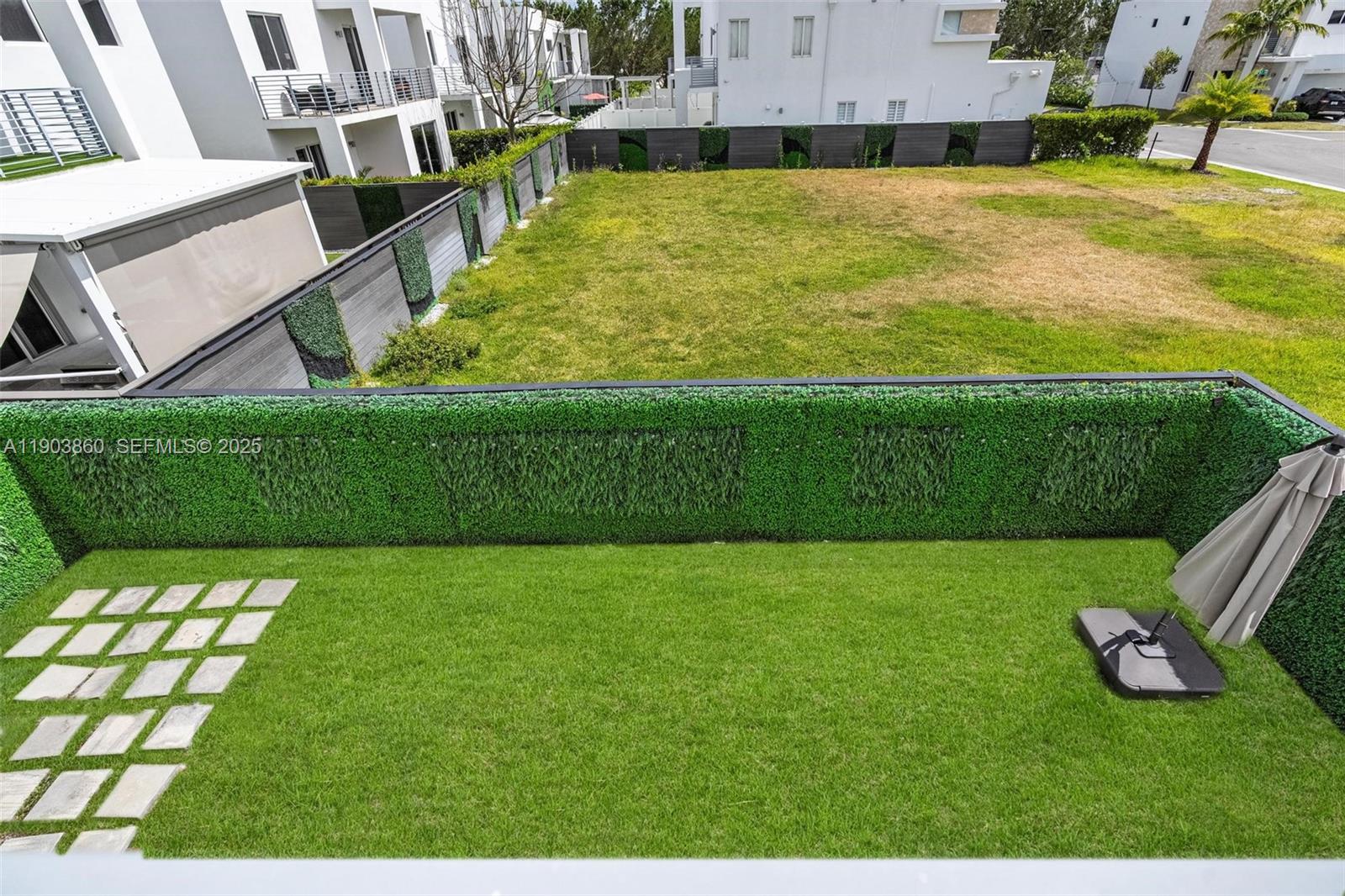 10330 Northwest 68th Street Doral, FL 33178 - Photo 41 of 60 a view of an outdoor space and a yard