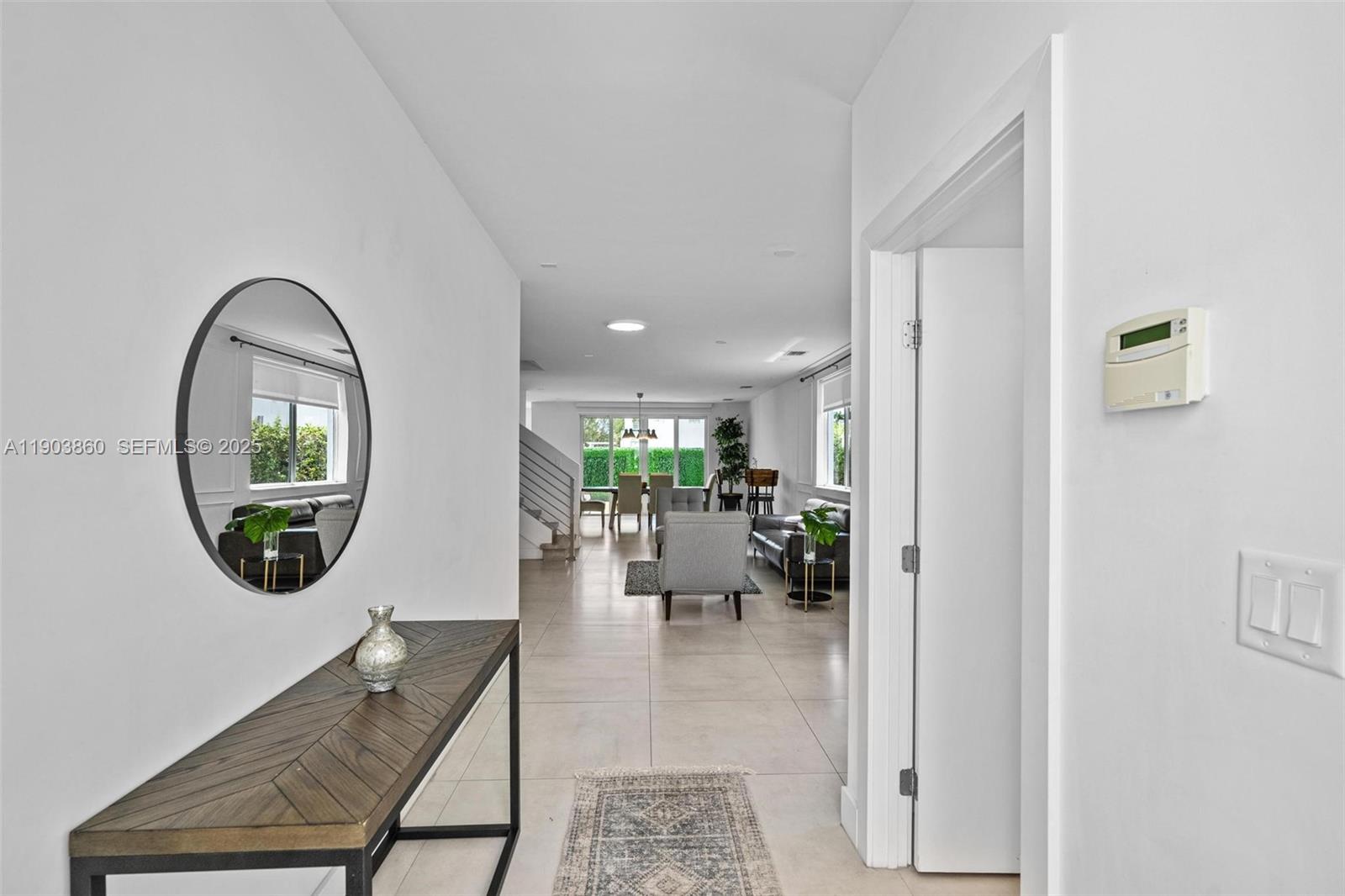 10330 Northwest 68th Street Doral, FL 33178 - Photo 6 of 60 wooden floor view with sitting space and windows