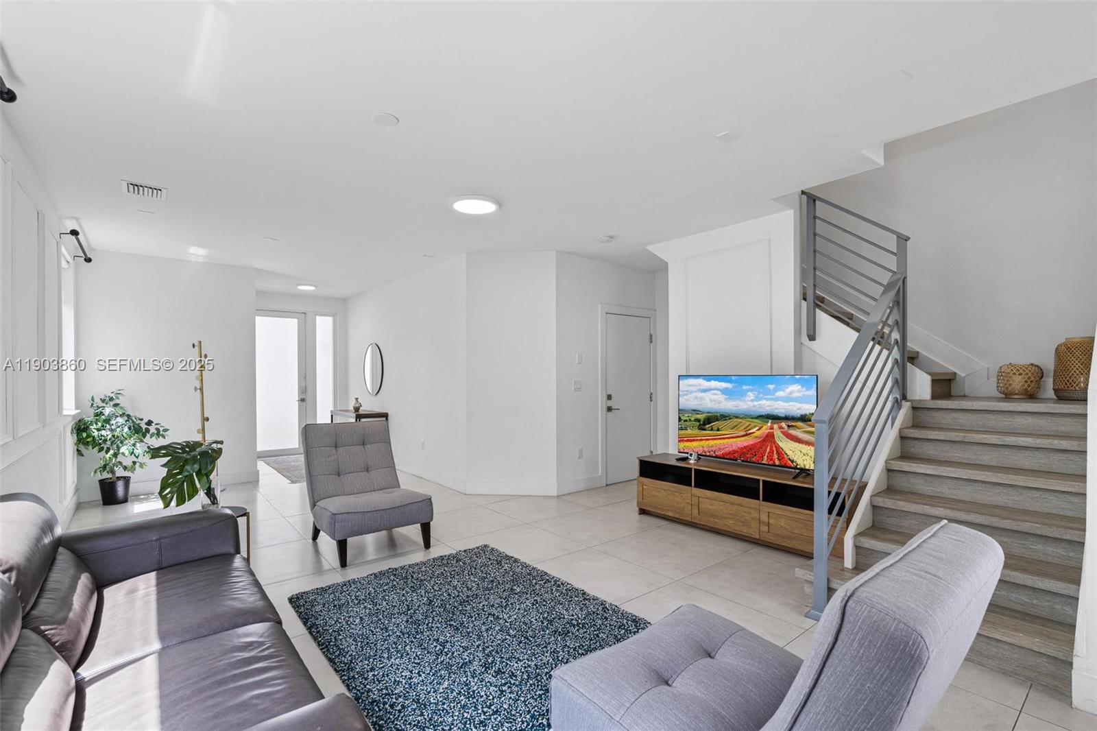 10330 Northwest 68th Street Doral, FL 33178 - Photo 9 of 60 a living room with furniture and a rug