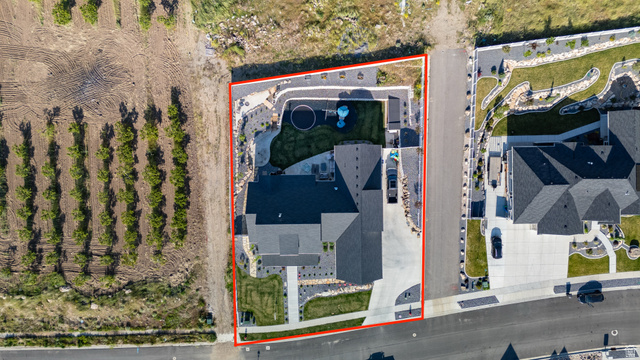 2013 South 100 West Perry, UT 84302 - Photo 43 of 49 Aerial view showcasing a property with a dark shingle roof, concrete driveways, and landscaped grounds