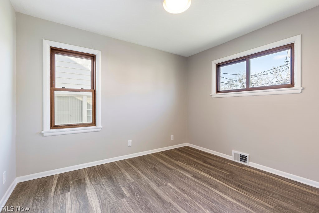 9620 David Road Garfield Heights, OH 44125 - Photo 18 of 36 Unfurnished room with dark wood-type flooring