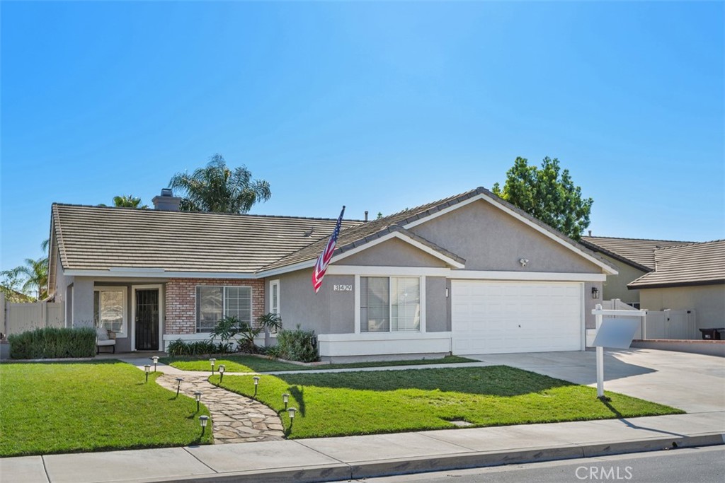 31429 Amsterdam Road Winchester, CA 92596 - Photo 1 of 1 a front view of a house with a yard and garage