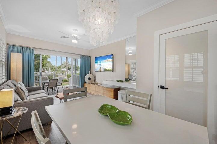 5092 Sunset Village Drive Duck Key, FL 33050 - Photo 2 of 48 a living room with furniture and a large window