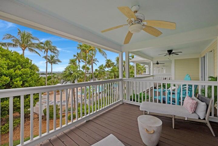 5092 Sunset Village Drive Duck Key, FL 33050 - Photo 35 of 48 a view of a balcony with furniture