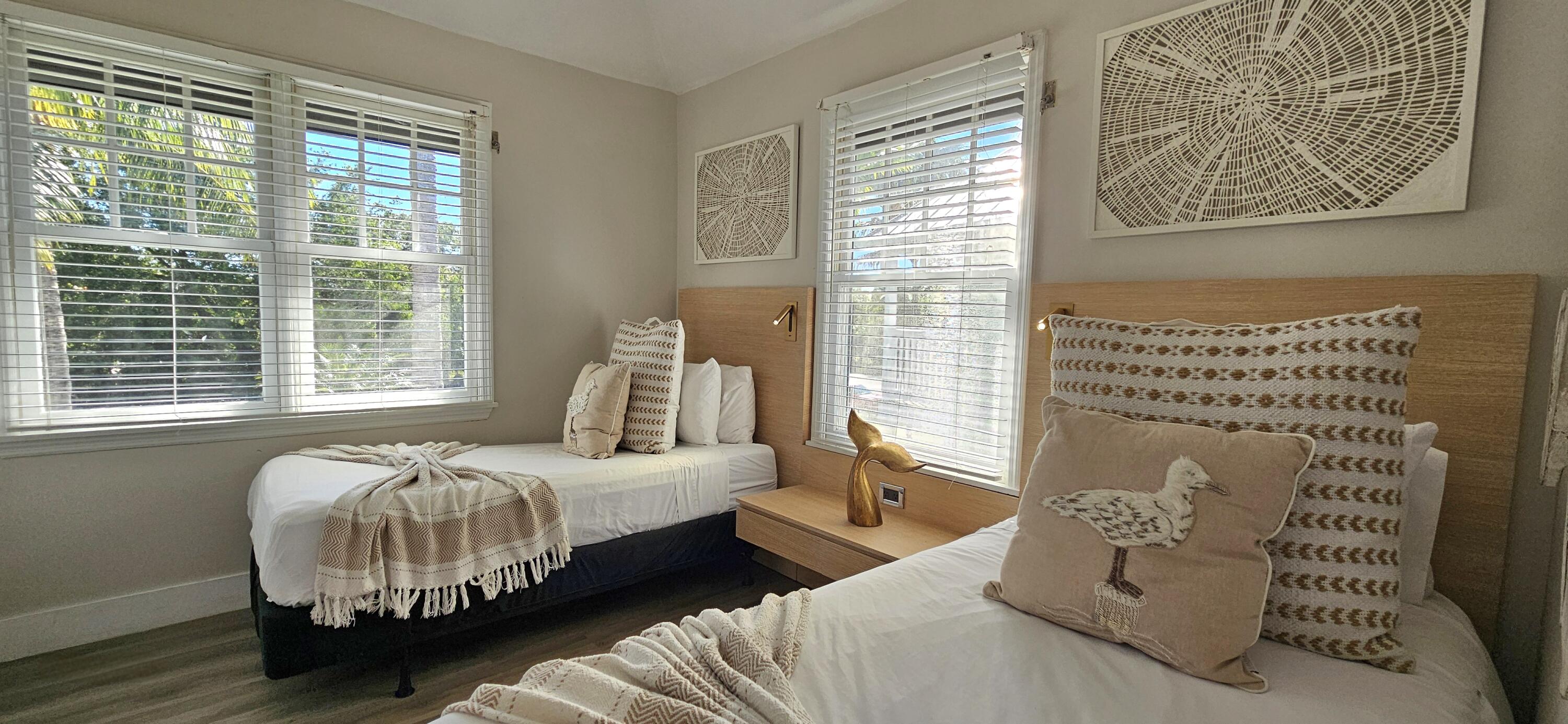 5092 Sunset Village Drive Duck Key, FL 33050 - Photo 36 of 48 a bedroom with bed and a window