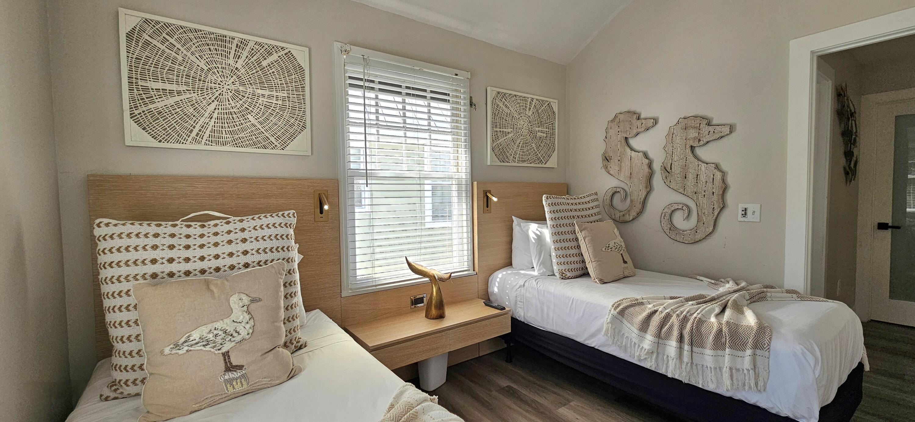 5092 Sunset Village Drive Duck Key, FL 33050 - Photo 37 of 48 a bedroom with a bed and two windows