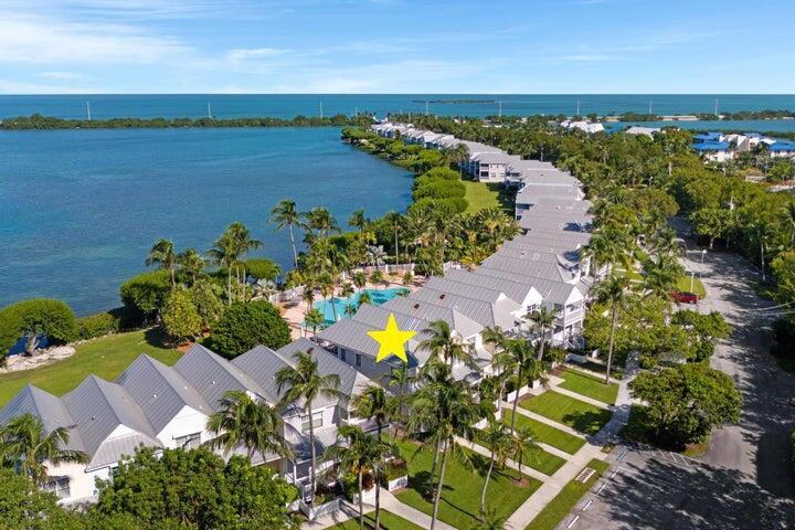 5092 Sunset Village Drive Duck Key, FL 33050 - Photo 43 of 48 an aerial view of a houses with a lake view