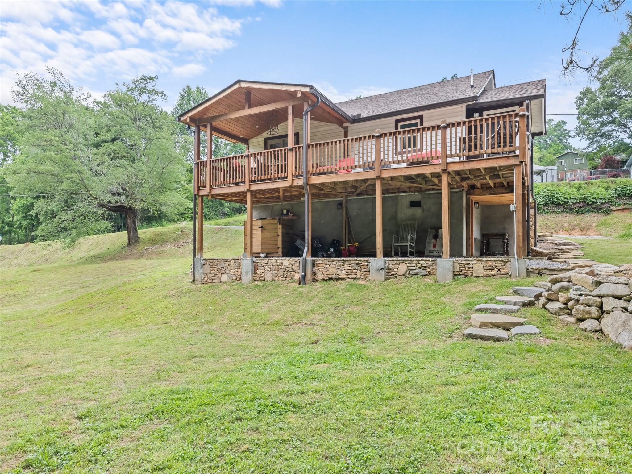 a view of a house with backyard porch and garden