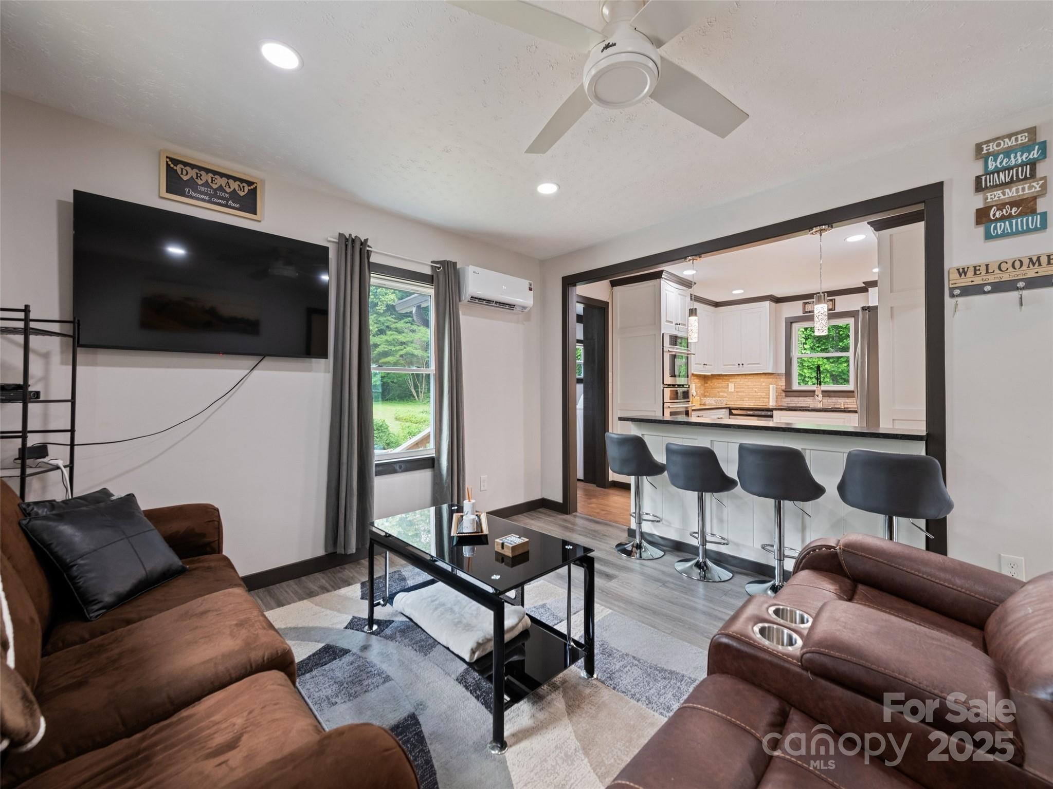 229 Yellow Bird Br Road Sylva, NC 28779 - Photo 12 of 34 a living room with furniture and a flat screen tv