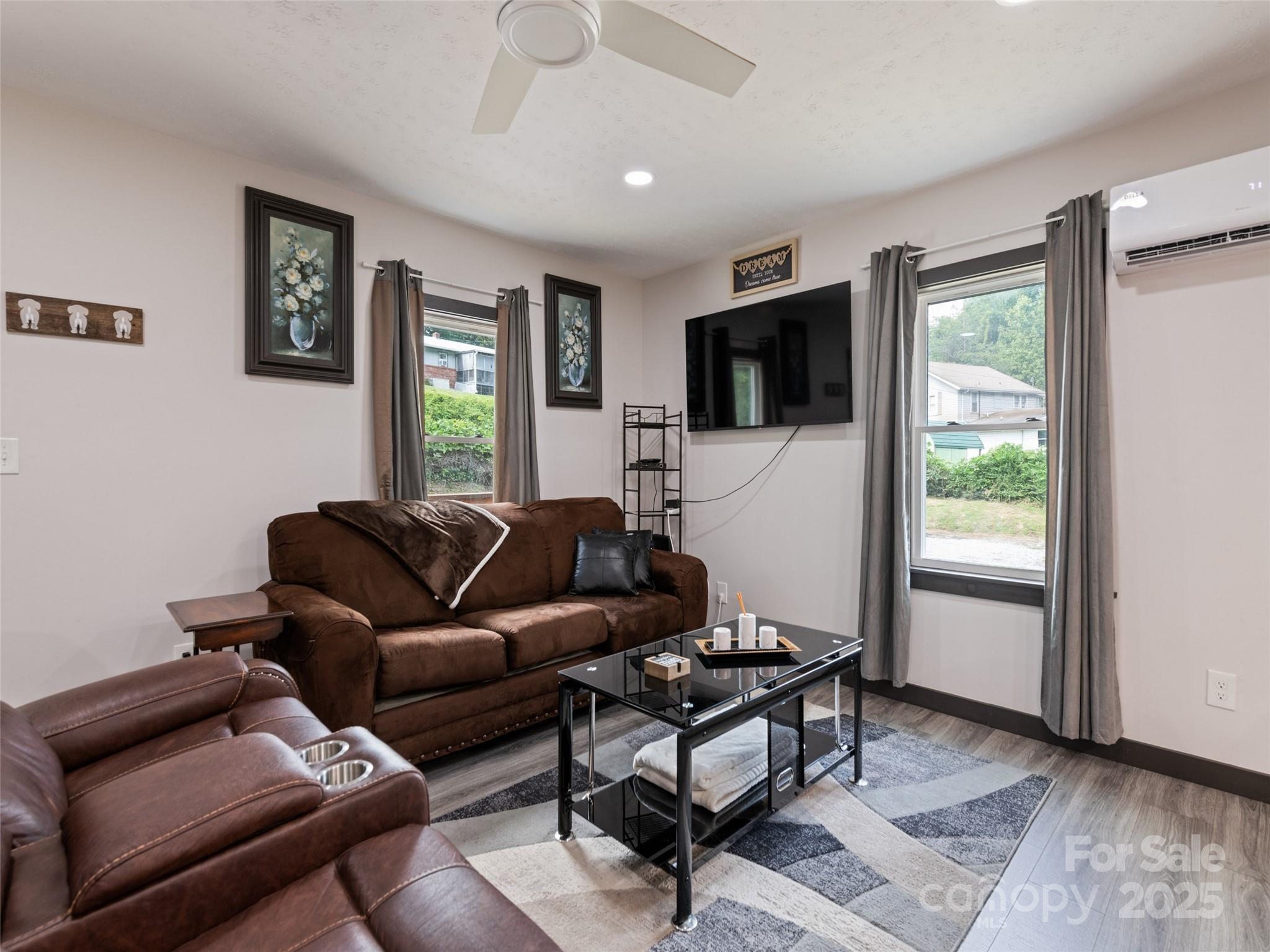 229 Yellow Bird Br Road Sylva, NC 28779 - Photo 13 of 34 a living room with furniture a flat screen tv and a window